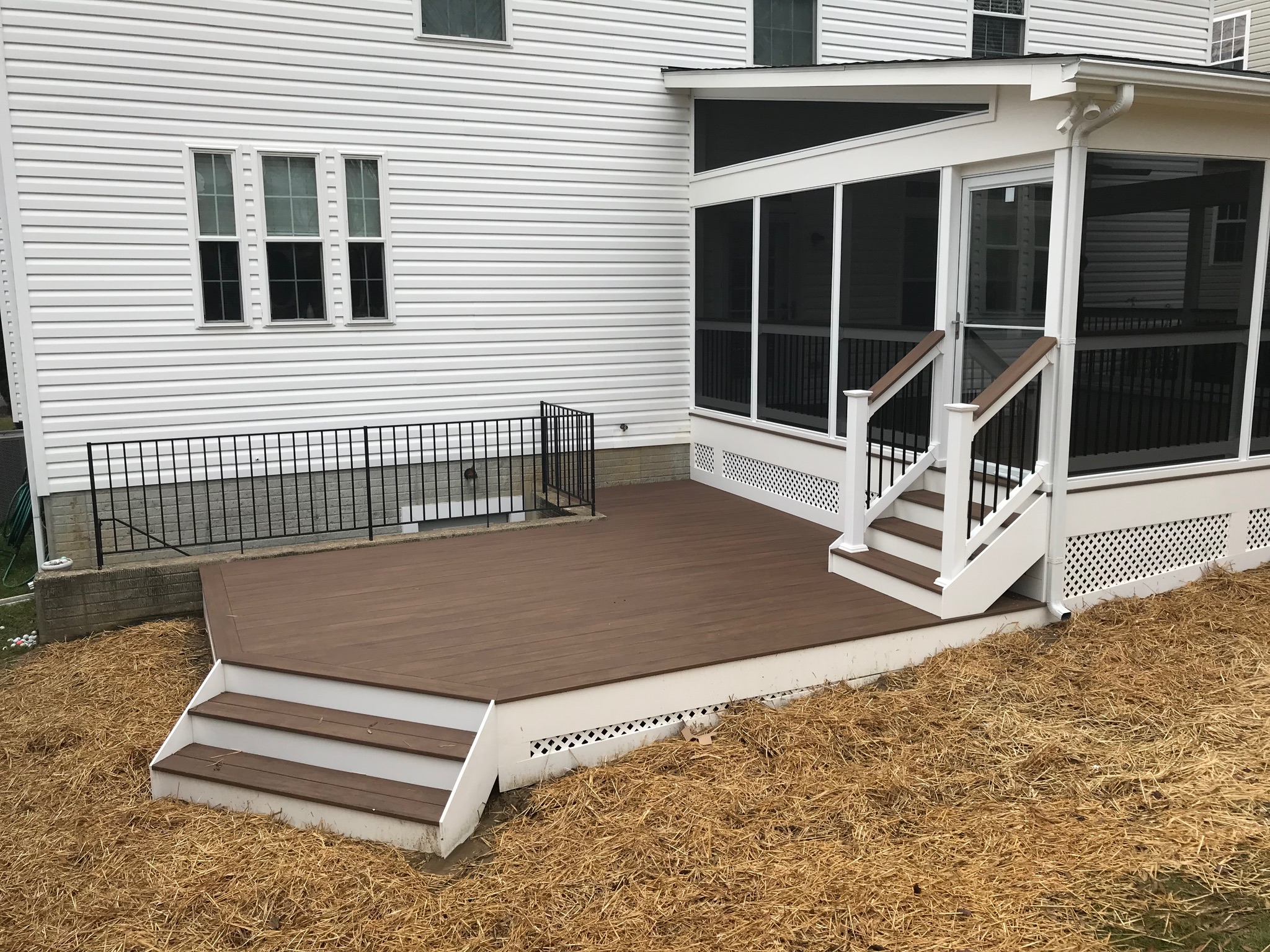 A house with a deck and a screened porch