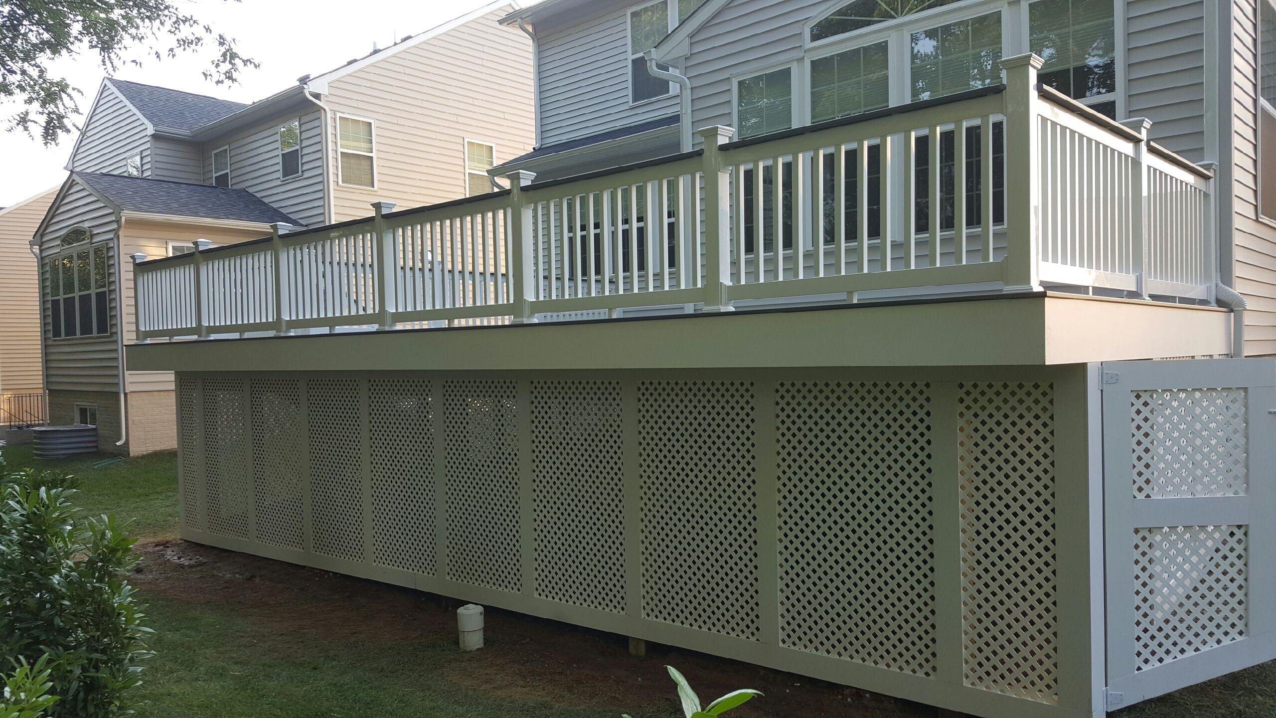 A house with a deck and a fence