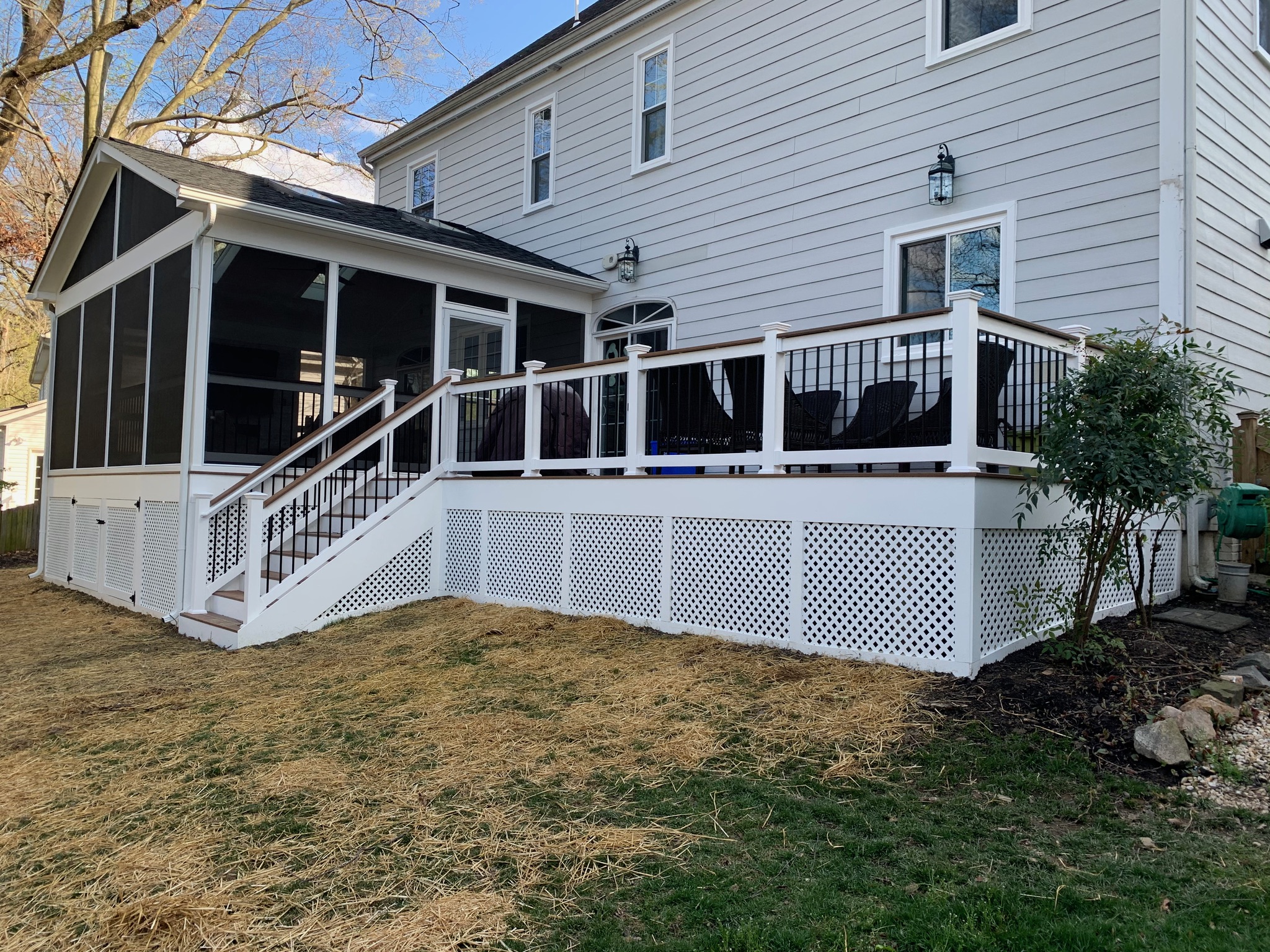 A house with a deck and a screened porch