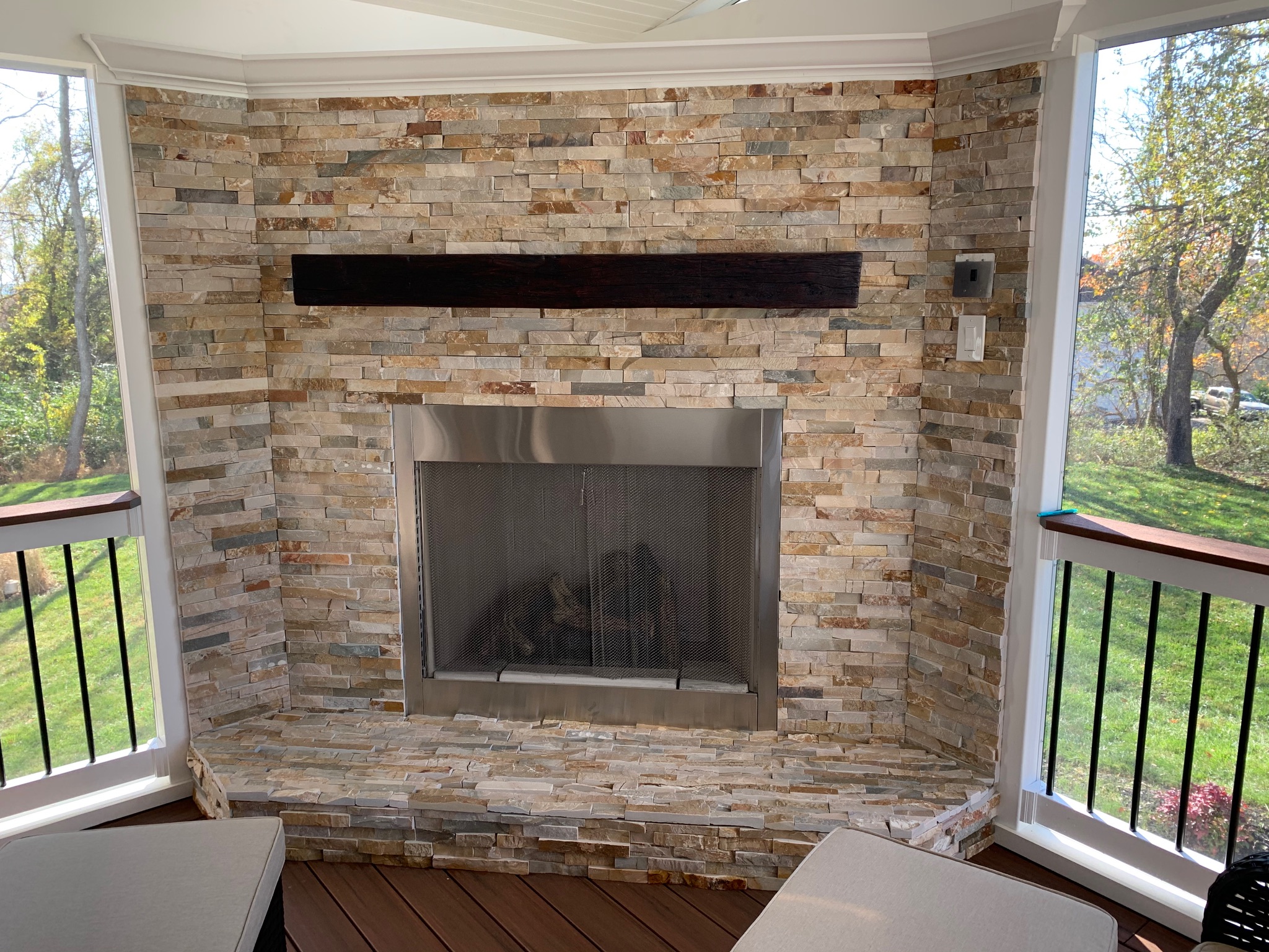 A living room with a fire place and a balcony