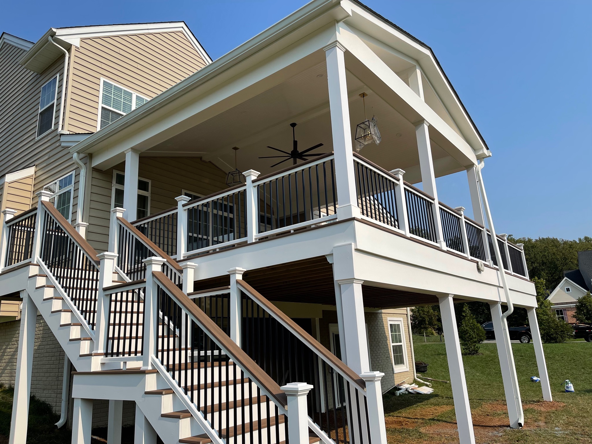 A large white house with a staircase leading up to it