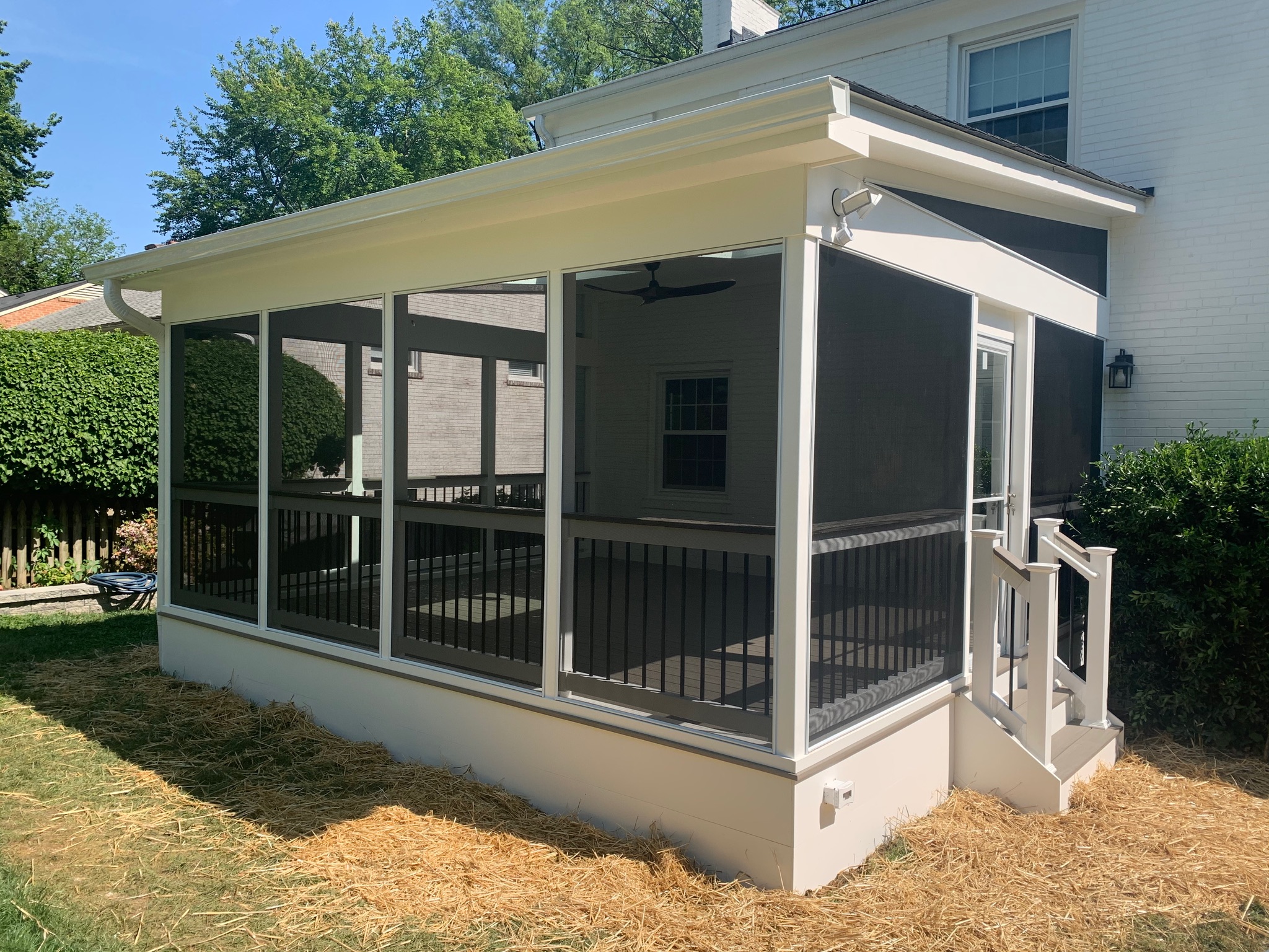 A screened in porch with a screened in porch