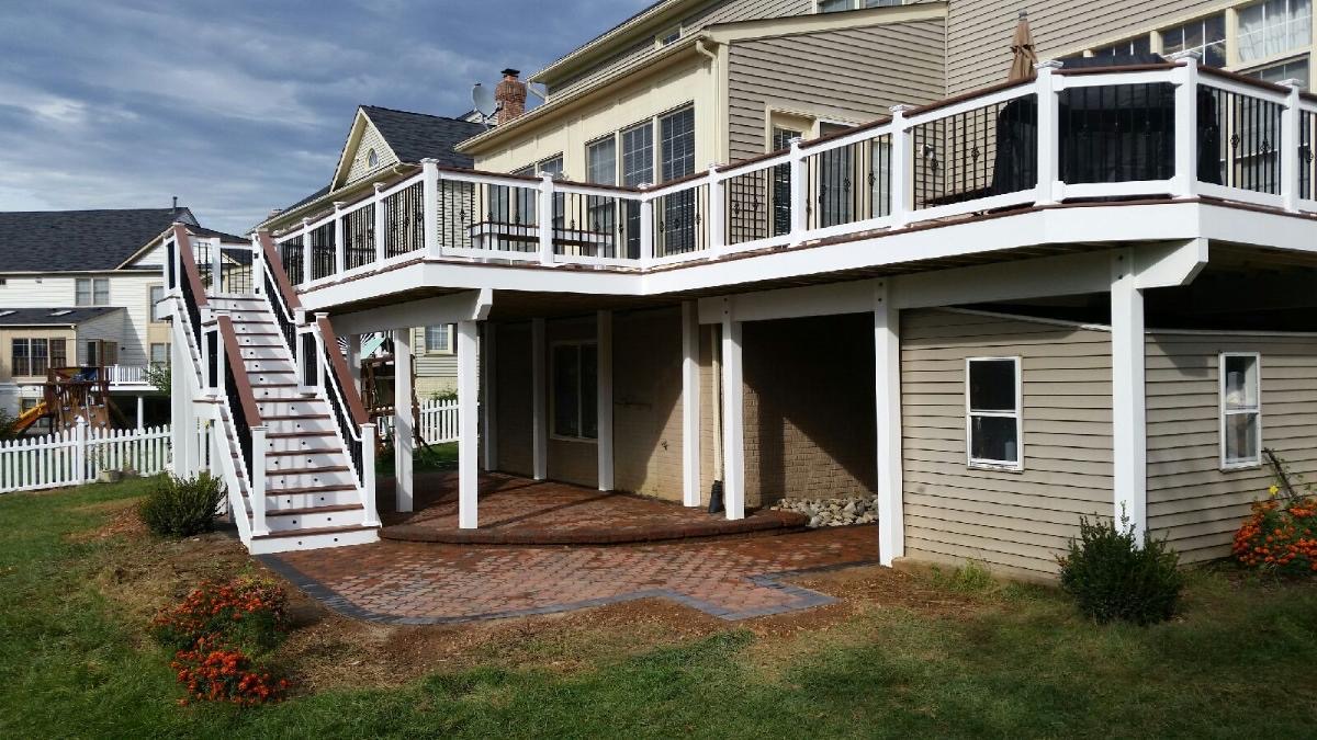 A house with a deck and stairs leading up to it